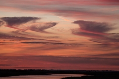 solnedgang over alto stratus og cirrus stratus